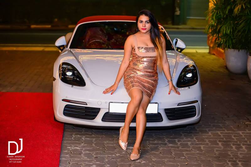 Shani Perera Posed On A Porsche